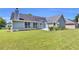 Beautiful backyard with a spacious lawn, attractive landscaping, and mature trees at 499 Running Doe Ct, Suwanee, GA 30024