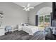 Bright bedroom offers a vaulted ceiling, large window, desk, and comfortable seating for a cozy space at 499 Running Doe Ct, Suwanee, GA 30024