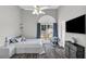Inviting bedroom with nice natural light, gray walls, ceiling fan, and calming decor at 499 Running Doe Ct, Suwanee, GA 30024