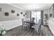 Elegant dining room with modern lighting and stylish decor at 499 Running Doe Ct, Suwanee, GA 30024