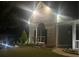 Charming home with a well-lit, landscaped front yard and eye-catching brick facade at 499 Running Doe Ct, Suwanee, GA 30024