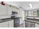 Well-lit kitchen with modern appliances and plenty of counter space at 499 Running Doe Ct, Suwanee, GA 30024