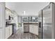 Modern kitchen with stainless steel appliances and ample cabinet space at 499 Running Doe Ct, Suwanee, GA 30024