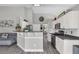Open kitchen with a breakfast bar and stainless steel appliances at 499 Running Doe Ct, Suwanee, GA 30024