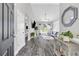 Open-concept living room with hardwood floors and natural light at 499 Running Doe Ct, Suwanee, GA 30024