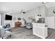 Open-concept living area with modern furnishings and a fireplace at 499 Running Doe Ct, Suwanee, GA 30024