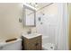 Cozy bathroom featuring a shower, single sink, and commode at 824 Hickory Ridge Sw Rd, Lilburn, GA 30047