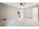 Bright bedroom featuring neutral walls and carpet, exterior window, and a closet at 824 Hickory Ridge Sw Rd, Lilburn, GA 30047