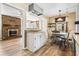 Hardwood floors connect the open concept living room, dining area, and eat-in kitchen at 824 Hickory Ridge Sw Rd, Lilburn, GA 30047