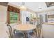 Eat-in kitchen featuring stainless steel appliances, white cabinetry, and a backyard view at 824 Hickory Ridge Sw Rd, Lilburn, GA 30047