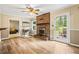 Spacious living room featuring a brick fireplace and access to the backyard patio at 824 Hickory Ridge Sw Rd, Lilburn, GA 30047