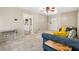 Comfortable living room featuring soft carpet and a view into the kitchen at 824 Hickory Ridge Sw Rd, Lilburn, GA 30047