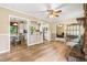 Open concept living room features hardwood flooring, views of kitchen and fireplace at 824 Hickory Ridge Sw Rd, Lilburn, GA 30047