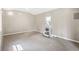 Neutral room with carpet and window. The walls are painted a clean, off-white shade. Bright natural light at 824 Hickory Ridge Sw Rd, Lilburn, GA 30047
