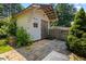 Exterior view of shed with a gable roof, pavers and landscaping at 824 Hickory Ridge Sw Rd, Lilburn, GA 30047