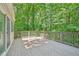Back deck overlooking a lush, wooded backyard provides privacy and nature views at 22 Dunwoody Springs Dr, Atlanta, GA 30328