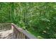 Wooden deck offers an expansive view of the private, wooded lot at 22 Dunwoody Springs Dr, Atlanta, GA 30328