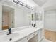 Bathroom featuring dual sinks, lots of counter space, and a large mirror at 22 Dunwoody Springs Dr, Atlanta, GA 30328