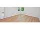 Corner bedroom with new flooring, modern ceiling fan, and natural light at 22 Dunwoody Springs Dr, Atlanta, GA 30328