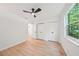 A bright bedroom with two closets, wood-look floors, and a ceiling fan at 22 Dunwoody Springs Dr, Atlanta, GA 30328