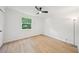 Bedroom with new flooring, ceiling fan, and natural light from the window at 22 Dunwoody Springs Dr, Atlanta, GA 30328