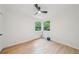 Bedroom features a ceiling fan and two windows for ample natural light at 22 Dunwoody Springs Dr, Atlanta, GA 30328