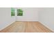 Bright room with wood-look floors and ample natural light from large windows at 22 Dunwoody Springs Dr, Atlanta, GA 30328