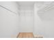 Bright closet featuring white walls, wood floor and wire shelving at 22 Dunwoody Springs Dr, Atlanta, GA 30328