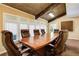 Spacious conference room featuring wood ceilings, large wood table, and leather chairs at 22 Dunwoody Springs Dr, Atlanta, GA 30328