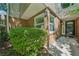 Inviting brick facade with lush green bushes, and a black front door for a welcoming entrance at 22 Dunwoody Springs Dr, Atlanta, GA 30328
