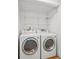 A tidy laundry area equipped with modern side-by-side washer and dryer at 22 Dunwoody Springs Dr, Atlanta, GA 30328