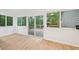 Living room with large windows and access to the outdoor deck at 22 Dunwoody Springs Dr, Atlanta, GA 30328