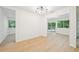 Open floor plan with modern light fixture and large windows at 22 Dunwoody Springs Dr, Atlanta, GA 30328