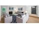 Staged living room with comfortable seating, a stylish rug, and a cozy fireplace at 22 Dunwoody Springs Dr, Atlanta, GA 30328