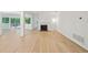 Bright living room with hardwood floors, fireplace, and access to an outdoor deck at 22 Dunwoody Springs Dr, Atlanta, GA 30328