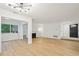 Modern living room with hardwood floors, a fireplace, and contemporary lighting fixtures at 22 Dunwoody Springs Dr, Atlanta, GA 30328