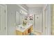 Bathroom featuring a double sink vanity, large mirror, and decorative accents at 2233 Hansford Pass, Buford, GA 30519