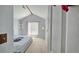 Bedroom with a vaulted ceiling and large window with light-filtering blinds at 2233 Hansford Pass, Buford, GA 30519