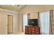 Bedroom featuring a large dresser and decorative curtains in a well-lit space at 2233 Hansford Pass, Buford, GA 30519