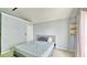Bedroom with large window offers peaceful retreat in soft, neutral tones at 2233 Hansford Pass, Buford, GA 30519