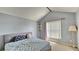 Bedroom features a large window providing natural light and soft-toned walls at 2233 Hansford Pass, Buford, GA 30519