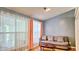 Cozy living room featuring hardwood floors, a comfortable sofa, and neutral wall color at 2233 Hansford Pass, Buford, GA 30519