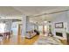 Open living area with vaulted ceilings, a fireplace, and wood floors at 2233 Hansford Pass, Buford, GA 30519