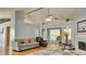 Spacious living room with a fireplace, vaulted ceilings, and wood floors at 2233 Hansford Pass, Buford, GA 30519