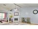 Bright living room featuring a fireplace, vaulted ceilings, and wood floors at 2233 Hansford Pass, Buford, GA 30519