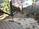 Backyard with mature trees and stone patio at 3948 Oak Glenn Dr, Duluth, GA 30096