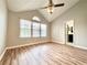 Serene bedroom with vaulted ceiling, fan, large windows, and access to ensuite bathroom, offering a private retreat at 3948 Oak Glenn Dr, Duluth, GA 30096