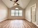 Bright bedroom featuring high ceilings, fan, large windows, and a neutral color palette, creating a tranquil space at 3948 Oak Glenn Dr, Duluth, GA 30096