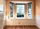 Cozy breakfast nook featuring a bay window with natural light and charming wood floors, ideal for enjoying meals at 3948 Oak Glenn Dr, Duluth, GA 30096