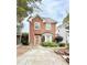 Charming two-story brick home with a well-manicured front yard and a cozy, inviting entrance at 3948 Oak Glenn Dr, Duluth, GA 30096